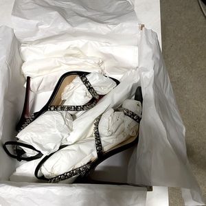 A new pair of Christian Louboutin heels size 8.5